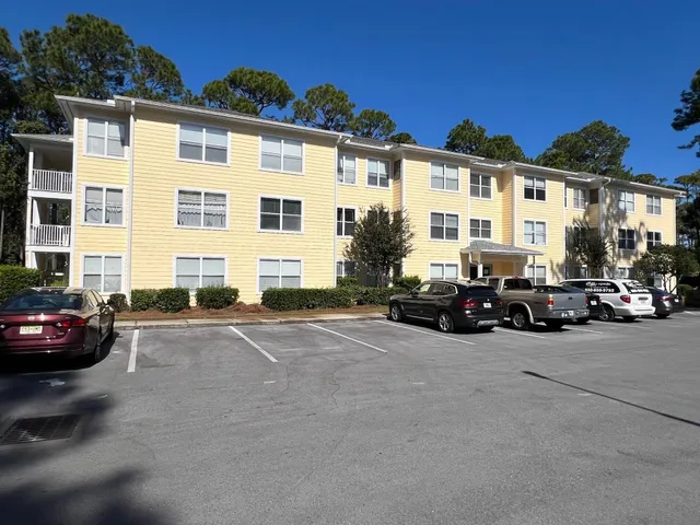 a view of a street with cars