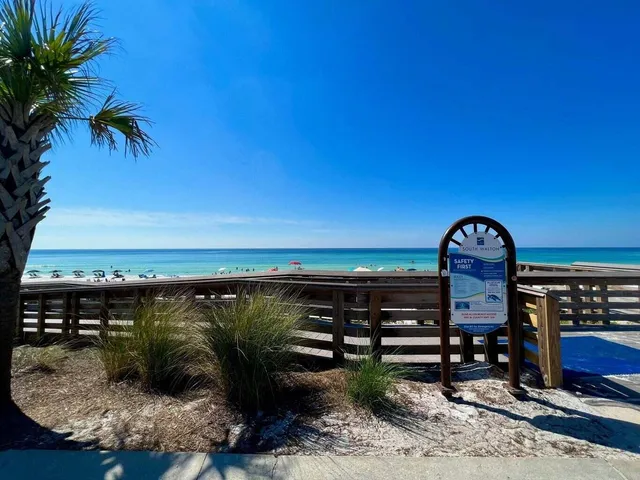 a view of a roof with potted plants and a table
