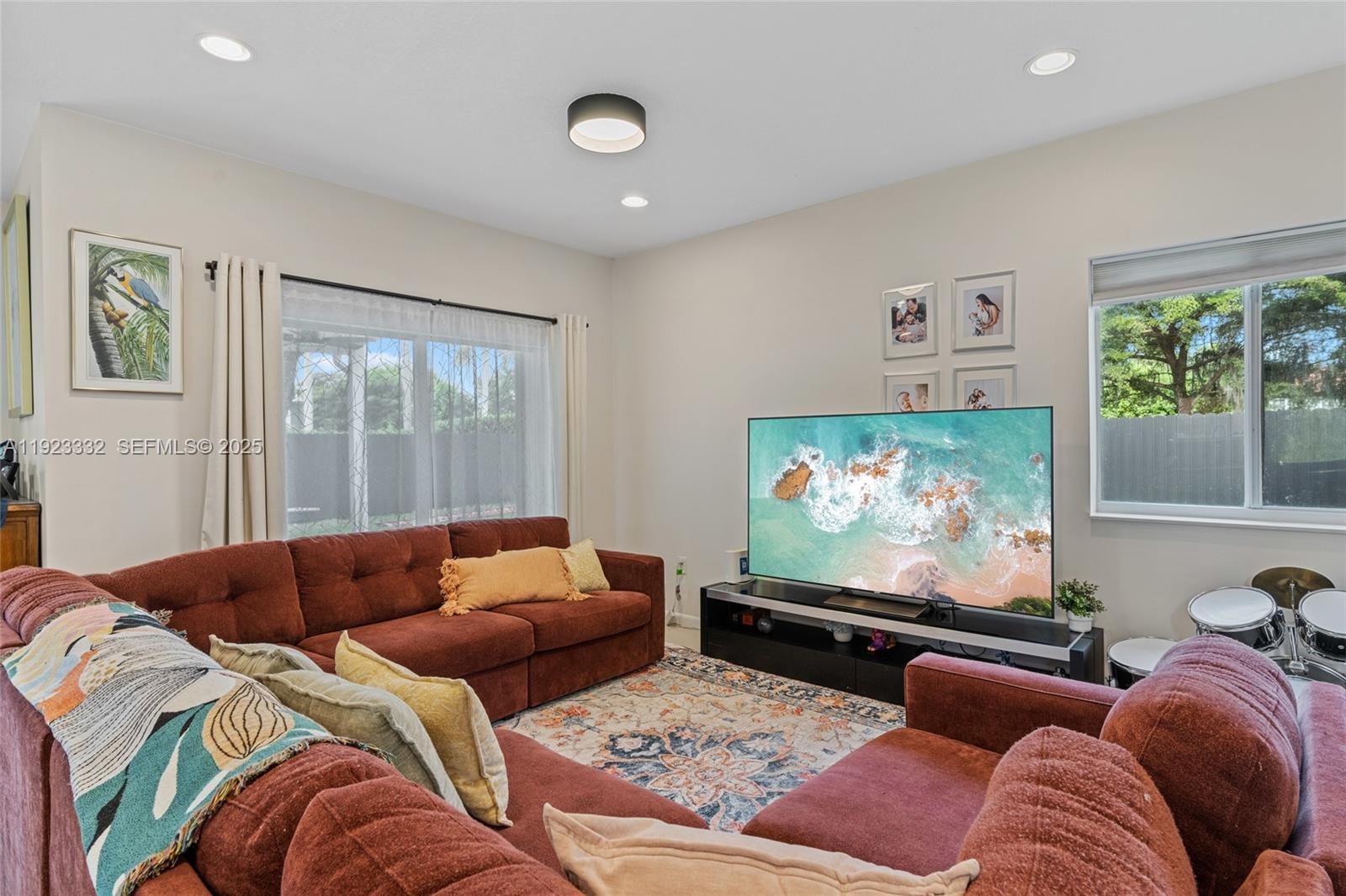 396 Northeast 33rd Terrace Homestead, FL 33033 - Photo 12 of 42 a living room with furniture and a flat screen tv