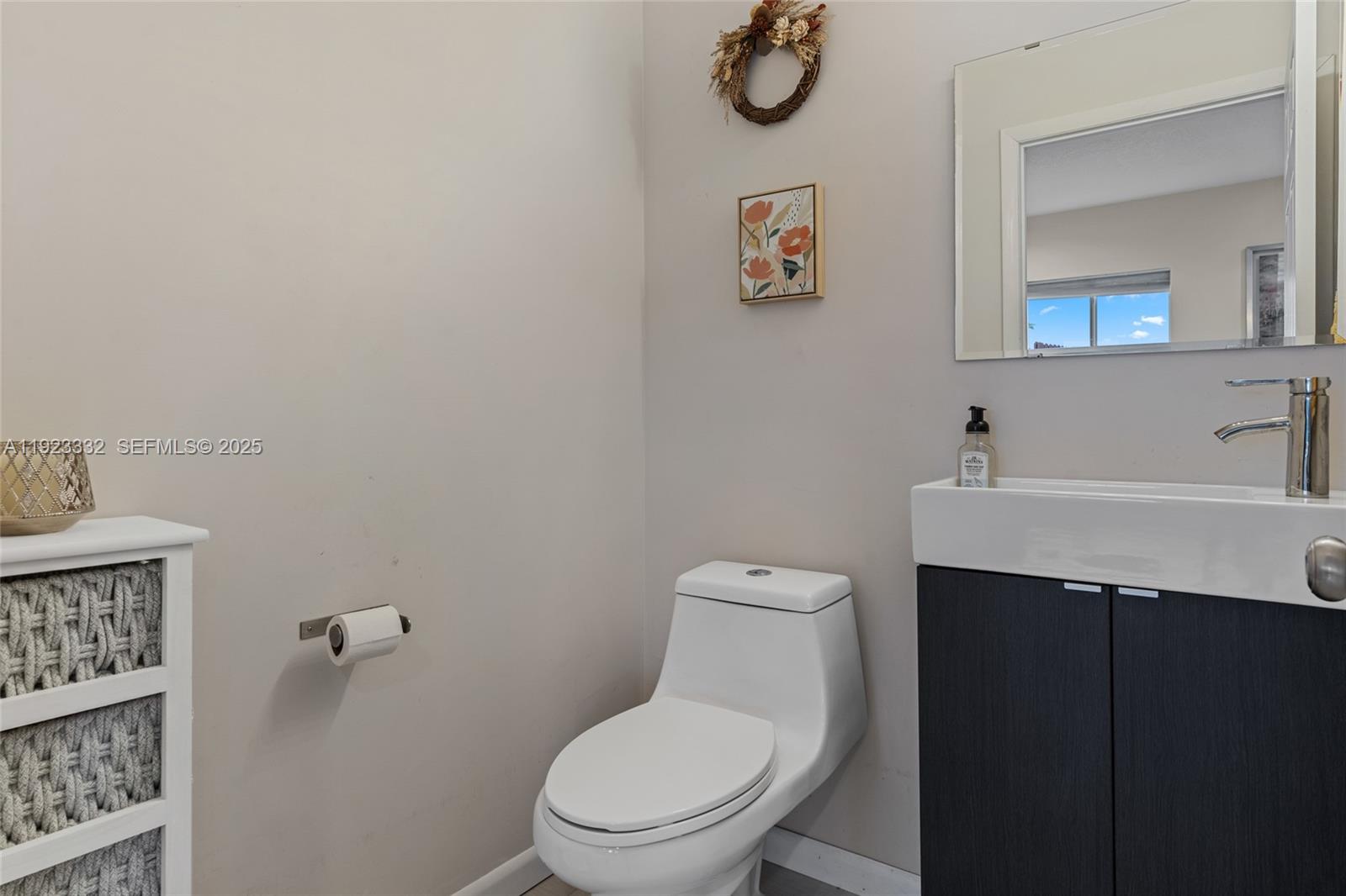 396 Northeast 33rd Terrace Homestead, FL 33033 - Photo 20 of 42 a white toilet sitting next to a bathroom sink