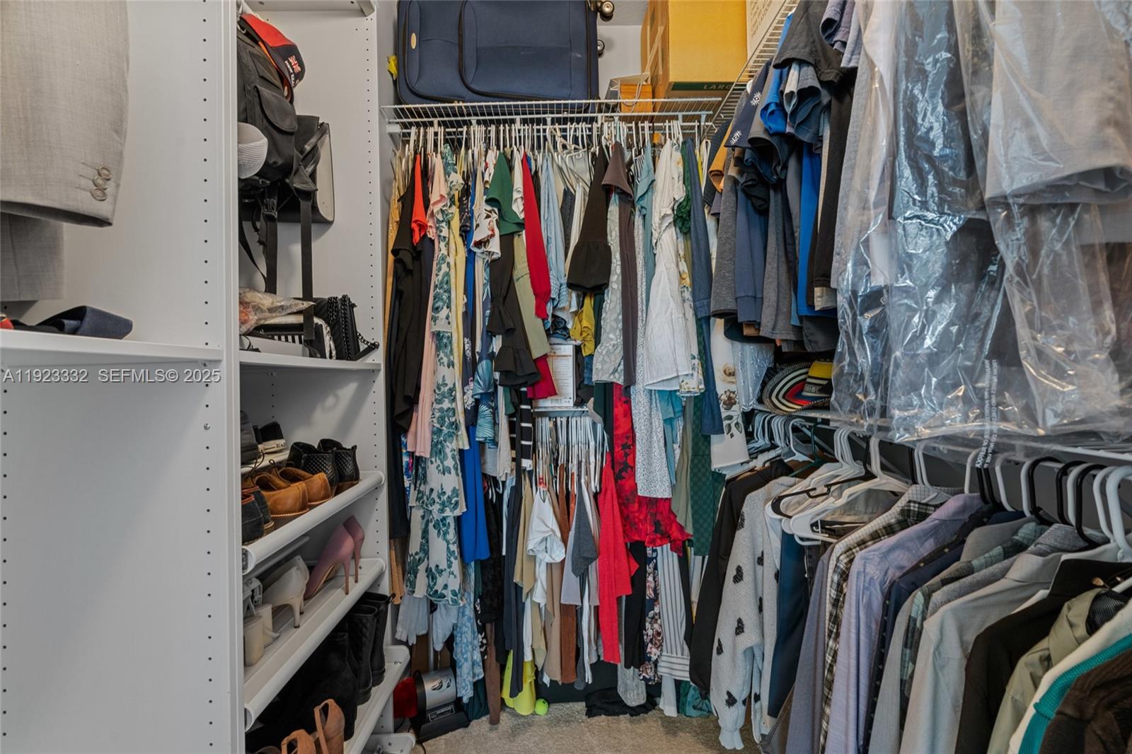 396 Northeast 33rd Terrace Homestead, FL 33033 - Photo 24 of 42 a view of walk in closet with clothes