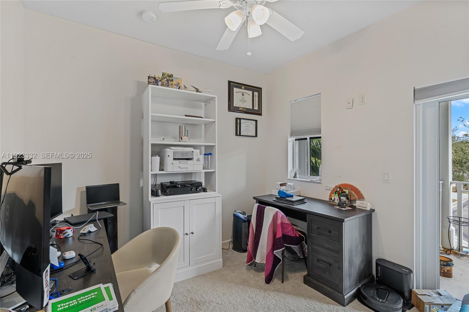 396 Northeast 33rd Terrace Homestead, FL 33033 - Photo 29 of 42 a view of a workspace with furniture and a window