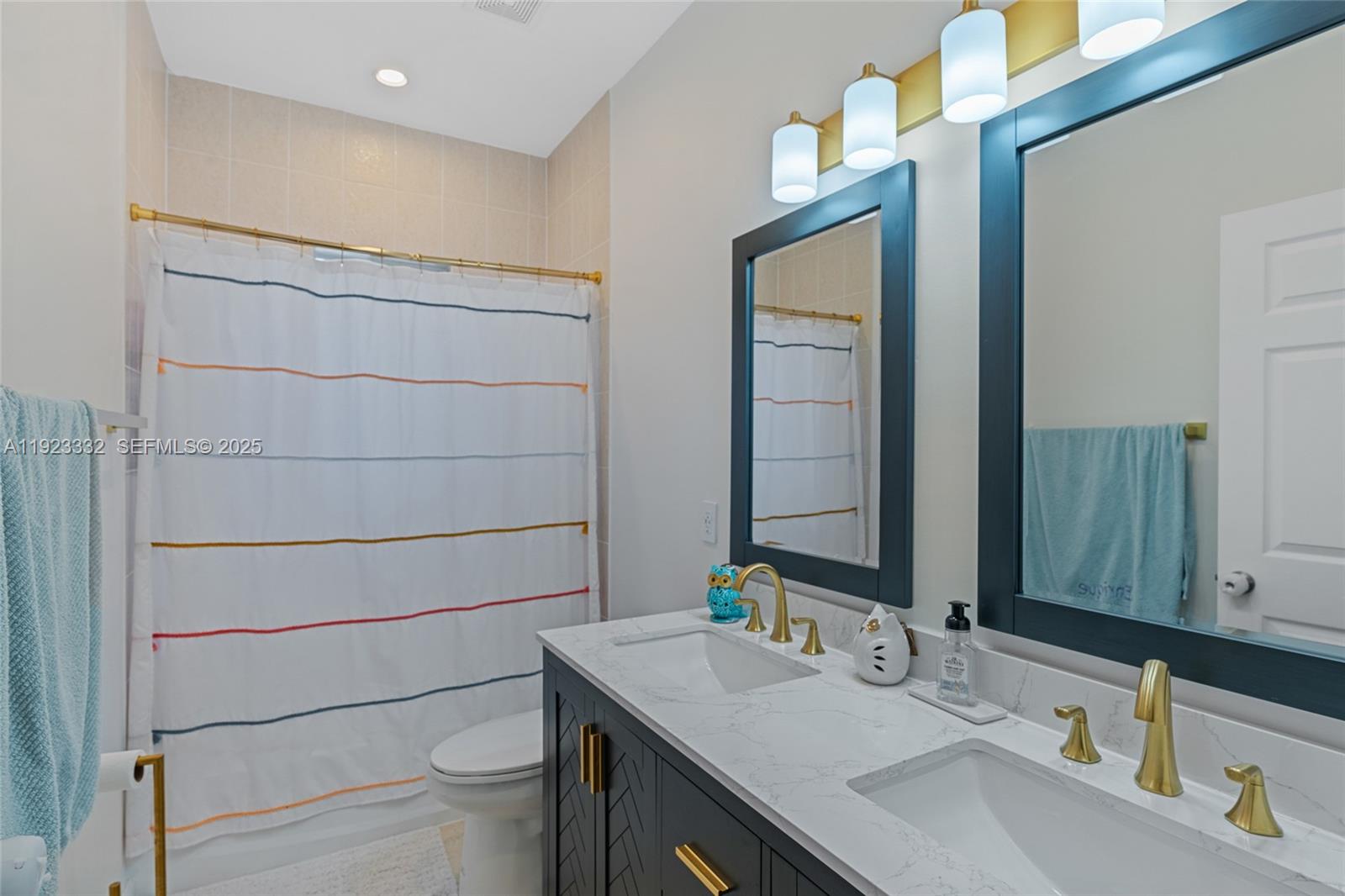 396 Northeast 33rd Terrace Homestead, FL 33033 - Photo 30 of 42 a bathroom with a sink a toilet and mirror