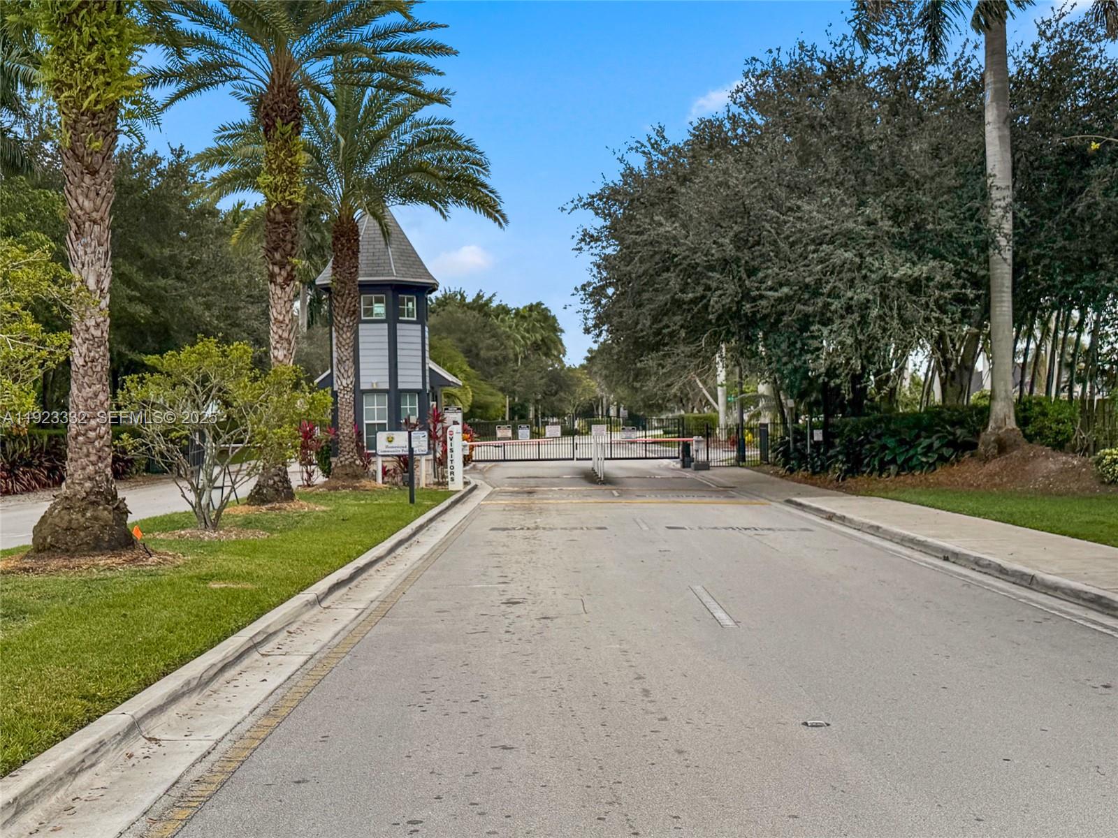 396 Northeast 33rd Terrace Homestead, FL 33033 - Photo 3 of 42 a view of road with yard and trees