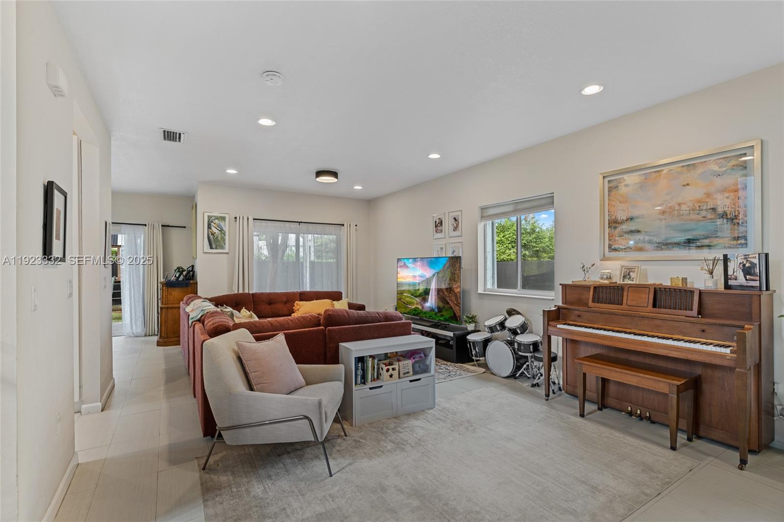 396 Northeast 33rd Terrace Homestead, FL 33033 - Photo 10 of 42 a living room with furniture and a large window