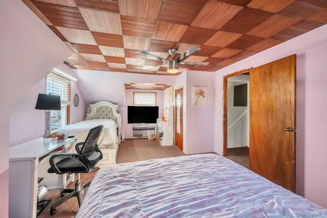 a bed room with a bed and a chandelier