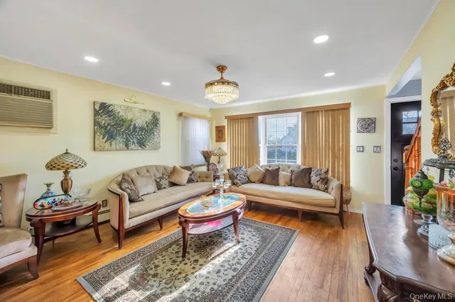 a living room with furniture potted plant and a window