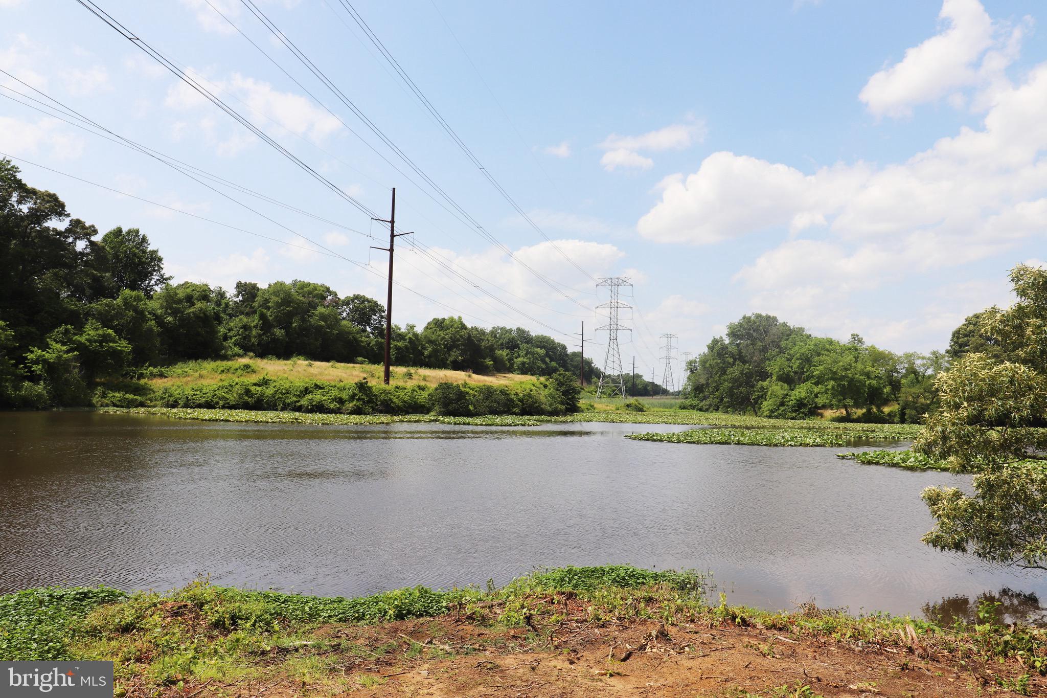 1481 Bunker Hill Road Middletown, DE 19709 - Photo 19 of 25 a view of a lake with a house in the background