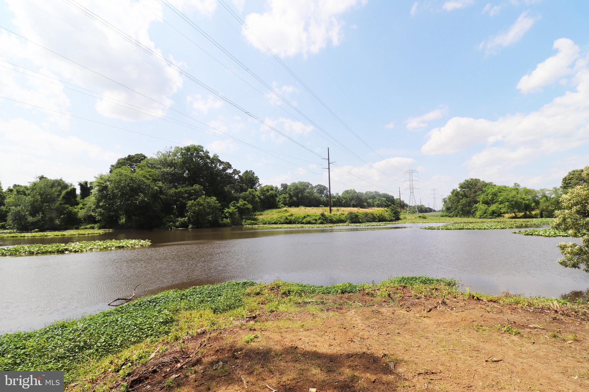 1481 Bunker Hill Road Middletown, DE 19709 - Photo 20 of 25 a view of a water pond with lots of green space