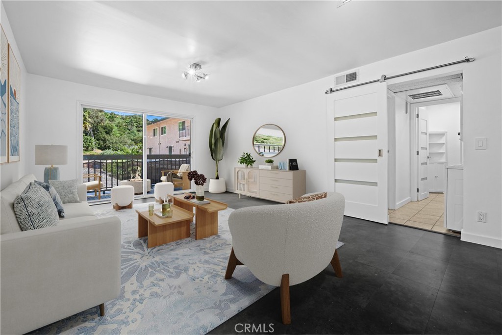2940 North Verdugo Road, Unit 214 Glendale, CA 91208 - Photo 2 of 10 a living room with furniture and a large window