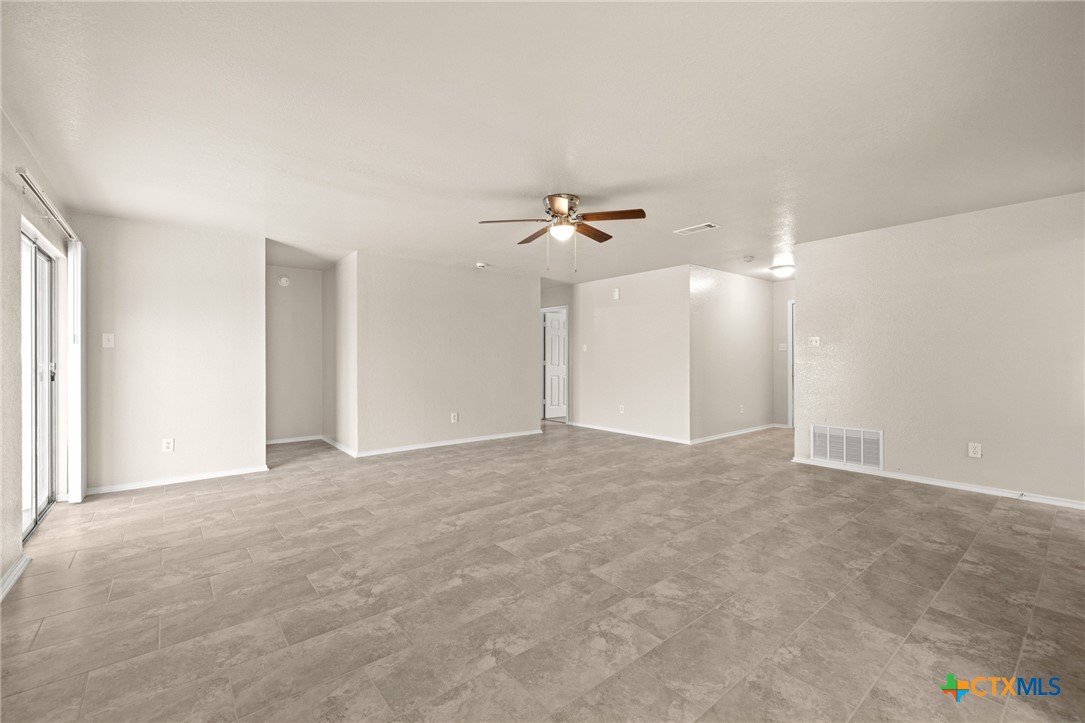 214 Timber Ridge Drive Nolanville, TX 76559 - Photo 10 of 31 a view of an empty room with a ceiling fan