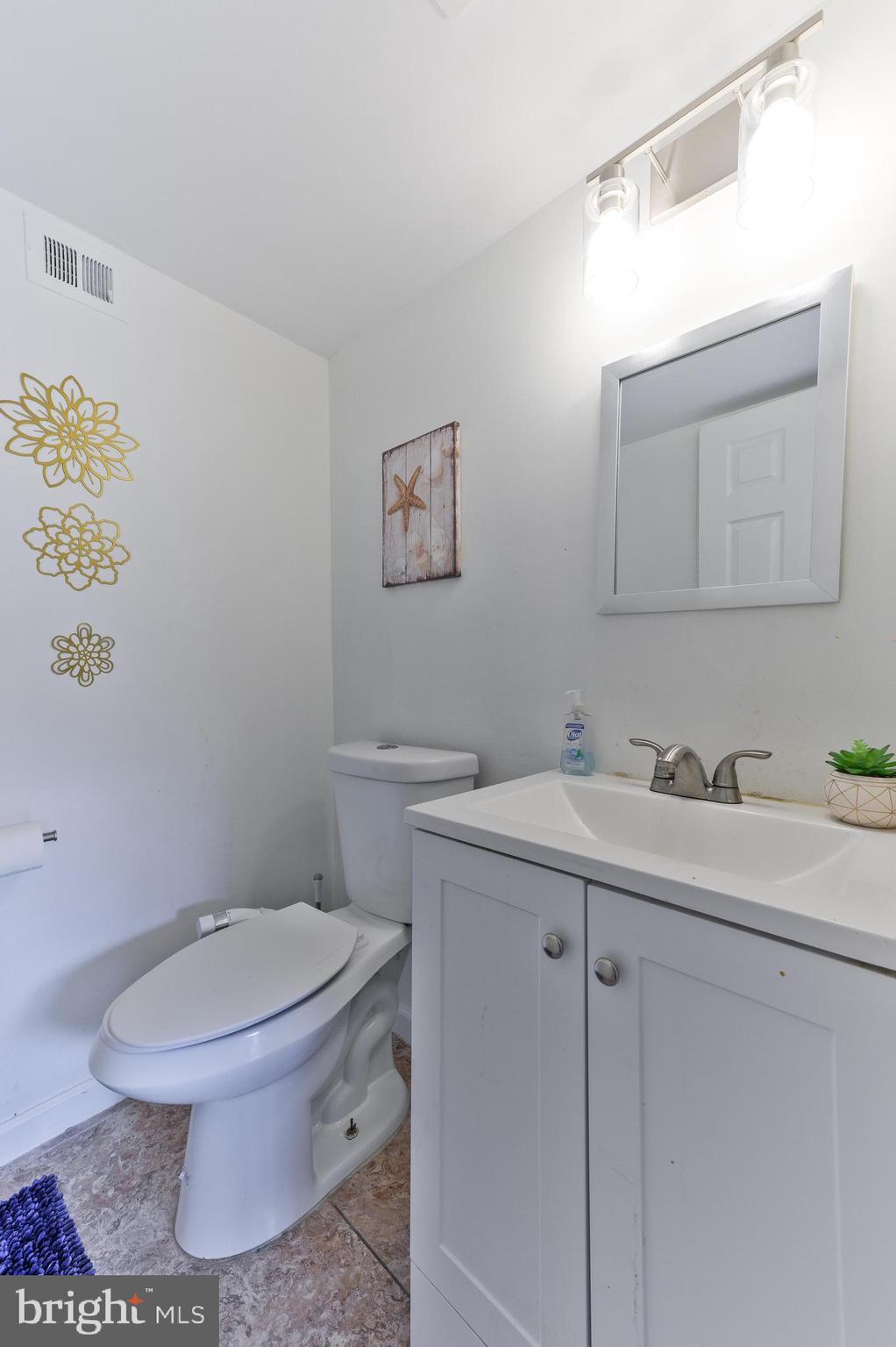 56 Dover Drive Lindenwold, NJ 08021 - Photo 13 of 20 a bathroom with a toilet sink and mirror