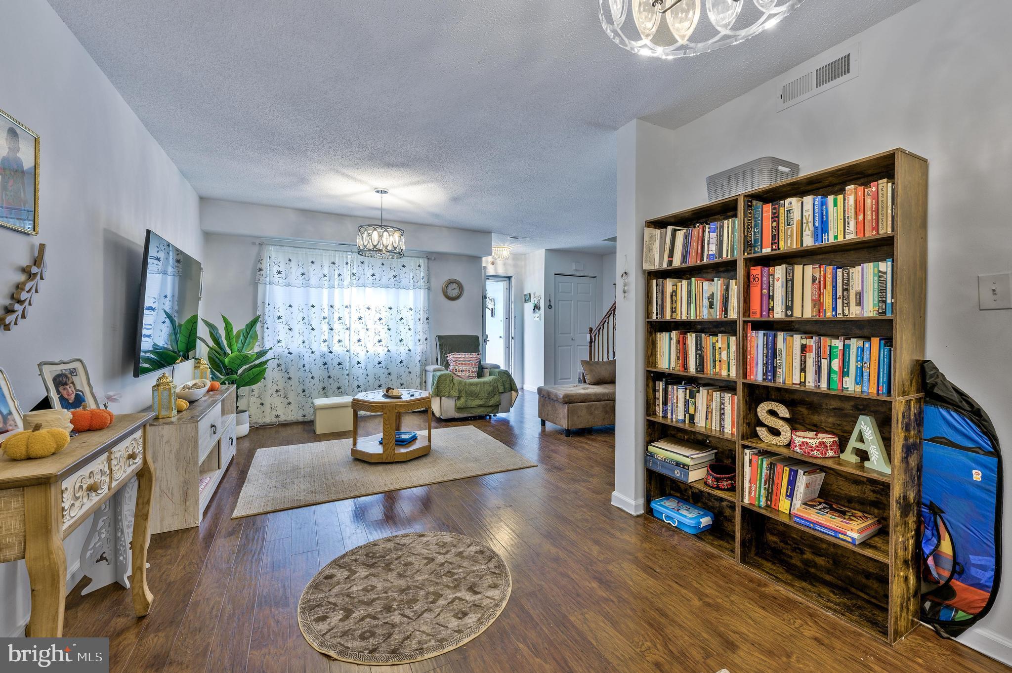 56 Dover Drive Lindenwold, NJ 08021 - Photo 8 of 20 a living room with furniture and a book shelf