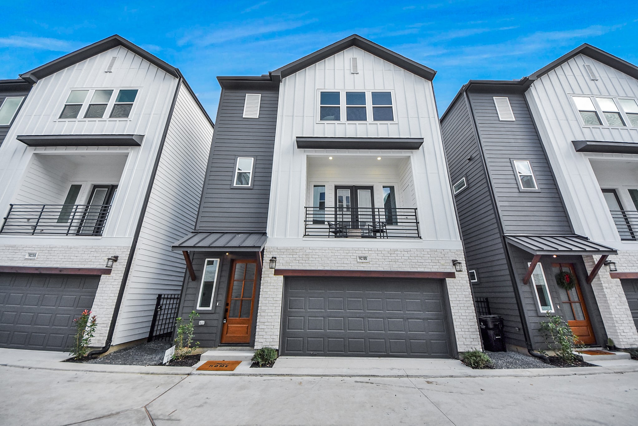This modern three-story townhouse welcomes you with a sleek white-and-gray exterior, a balcony for enjoying the outdoors, and a spacious two-car garage. Designed for contemporary living, it combines style, functionality, and low-maintenance convenience in the heart of Oak Forest.