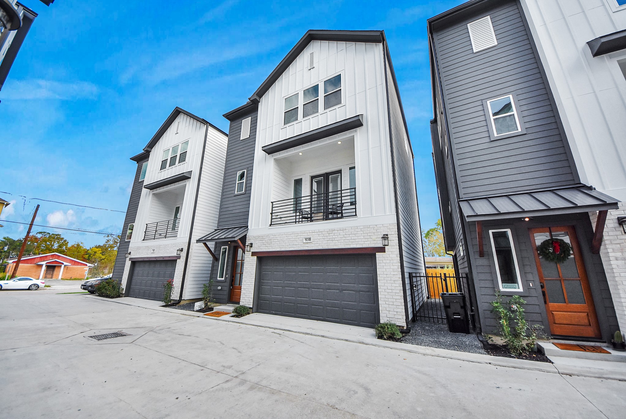 925 Fisher Street, Unit B Houston, TX 77018 - Photo 44 of 47 These modern three-story townhomes showcase clean lines and mixed materials, each with a two-car garage and balcony. The design blends style and functionality, ideal for urban living.
