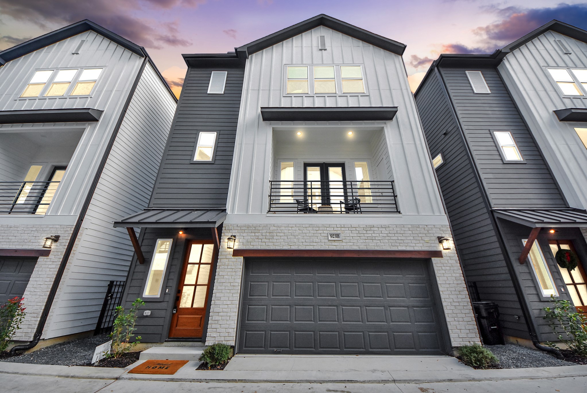 925 Fisher Street, Unit B Houston, TX 77018 - Photo 45 of 47 These modern three-story townhomes showcase clean lines and mixed materials, each with a two-car garage and balcony. The design blends style and functionality, ideal for urban living.