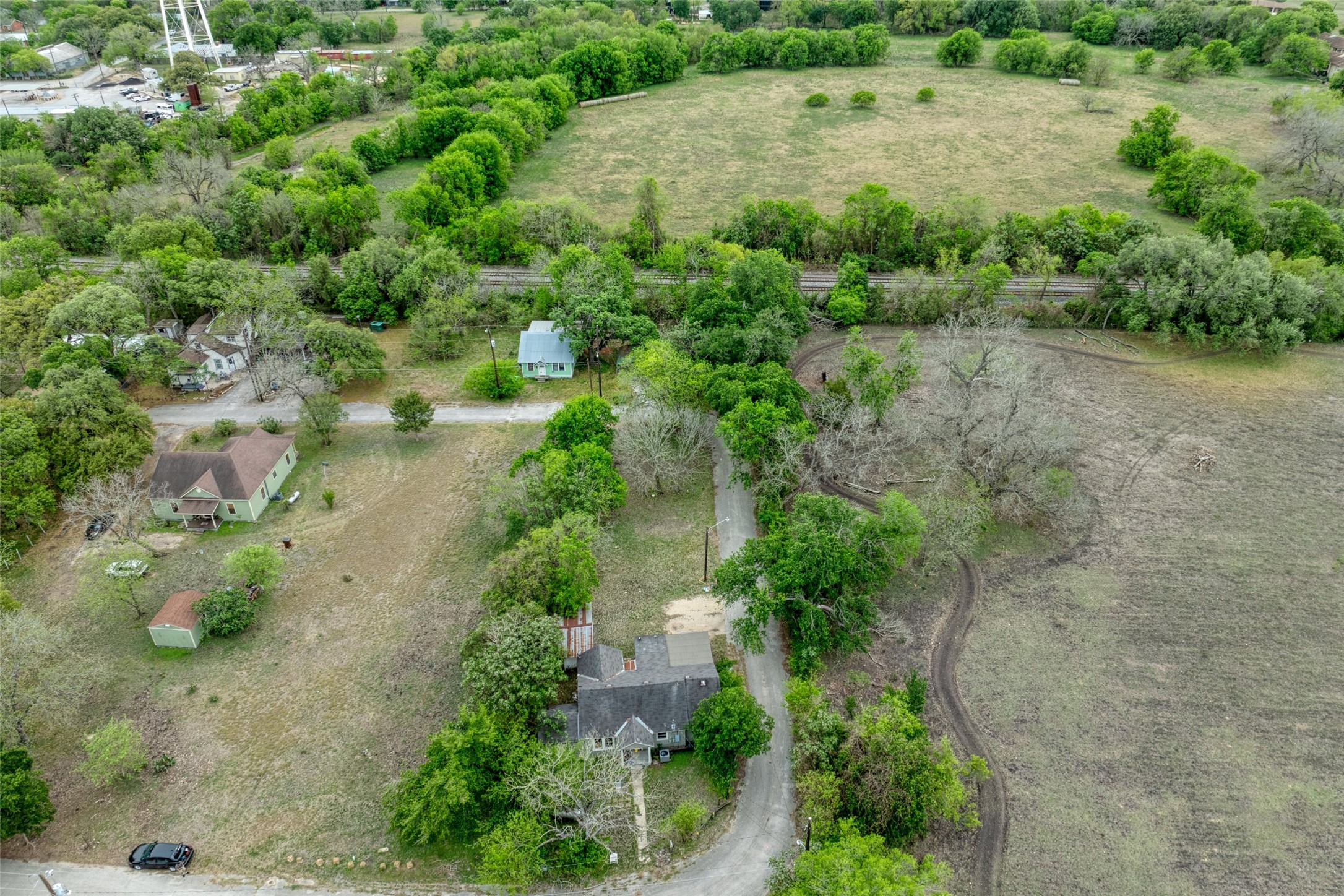 1006 Proctor Street Lockhart, TX 78644 - Photo 4 of 24 an aerial view of a house with a yard