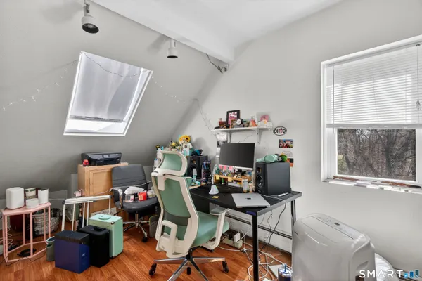 a work room with furniture and a window