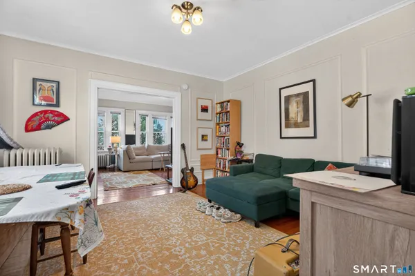 a living room with furniture and a flat screen tv