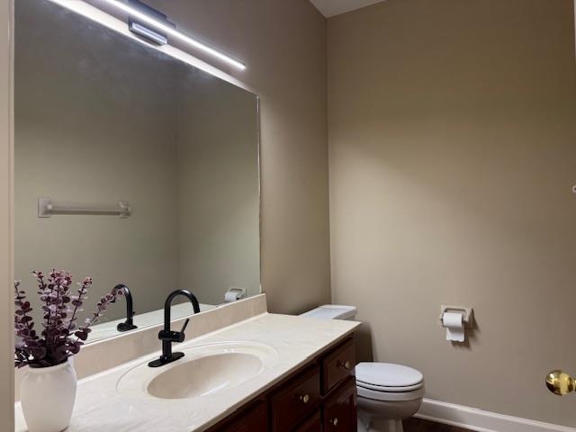 8668 Stablemill Lane Memphis, TN 38016 - Photo 11 of 36 a bathroom with a sink vanity mirror and toilet