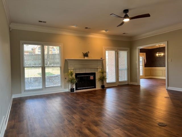 8668 Stablemill Lane Memphis, TN 38016 - Photo 13 of 36 an empty room with wooden floor fireplace and windows