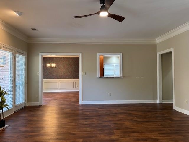 8668 Stablemill Lane Memphis, TN 38016 - Photo 15 of 36 a view of an empty room with wooden floor and a window
