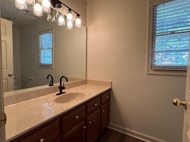 8668 Stablemill Lane Memphis, TN 38016 - Photo 21 of 36 a bathroom with a sink a vanity and a mirror