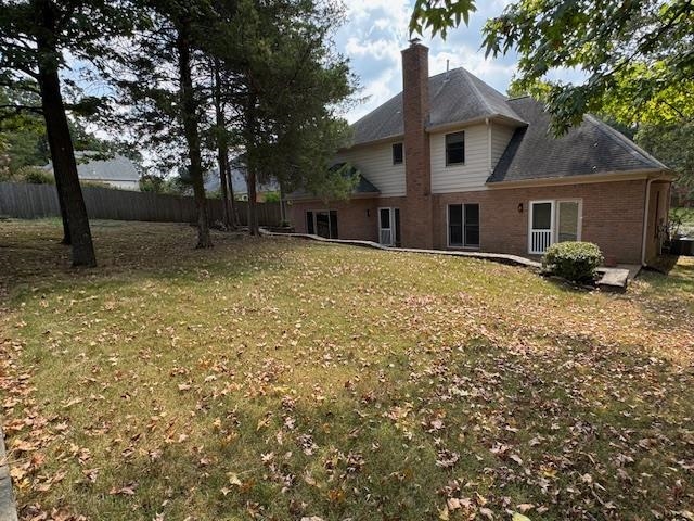 8668 Stablemill Lane Memphis, TN 38016 - Photo 24 of 36 a front view of a house with a yard