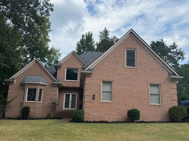 8668 Stablemill Lane Memphis, TN 38016 - Photo 27 of 36 a front view of a house with a yard