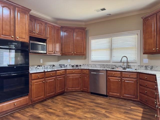 8668 Stablemill Lane Memphis, TN 38016 - Photo 3 of 36 a kitchen with stainless steel appliances granite countertop a sink and cabinets