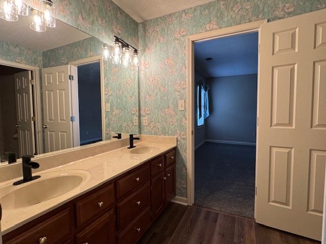 8668 Stablemill Lane Memphis, TN 38016 - Photo 32 of 36 a bathroom with a double vanity sink and a mirror