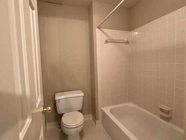 8668 Stablemill Lane Memphis, TN 38016 - Photo 33 of 36 a white toilet sitting next to a bath tub