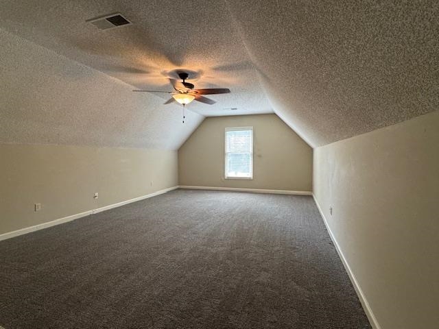 8668 Stablemill Lane Memphis, TN 38016 - Photo 35 of 36 en empty room with windows and chandelier fan
