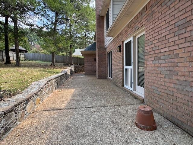 8668 Stablemill Lane Memphis, TN 38016 - Photo 36 of 36 a view of a backyard with chair and tables