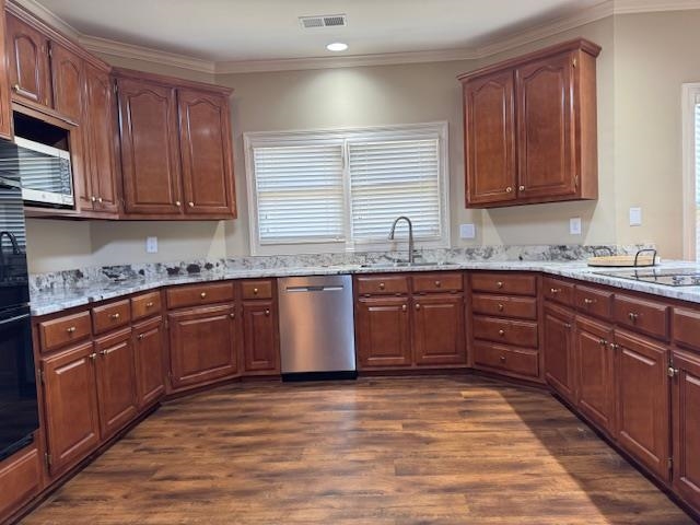 8668 Stablemill Lane Memphis, TN 38016 - Photo 6 of 36 a kitchen with stainless steel appliances granite countertop a sink a stove cabinets and wooden floor