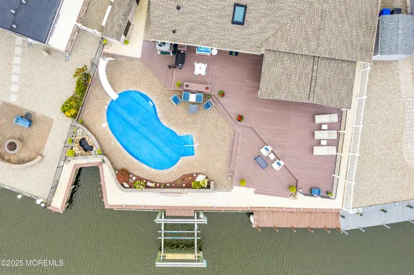 a view of a swimming pool with seating area