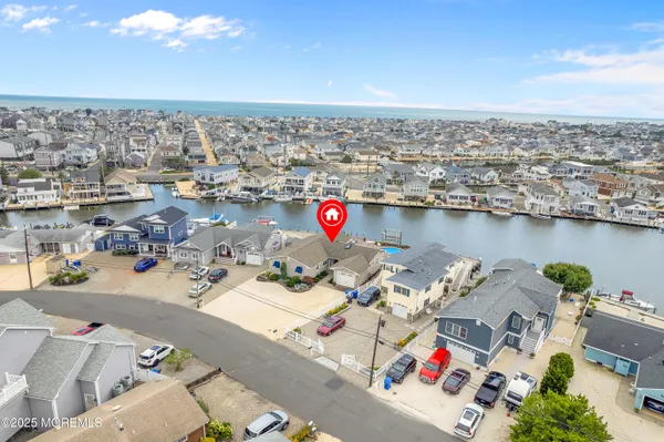 a view of a dining room with furniture wooden floor and chandelier