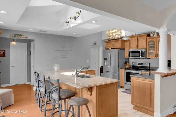a bathroom with a double vanity sink toilet and shower