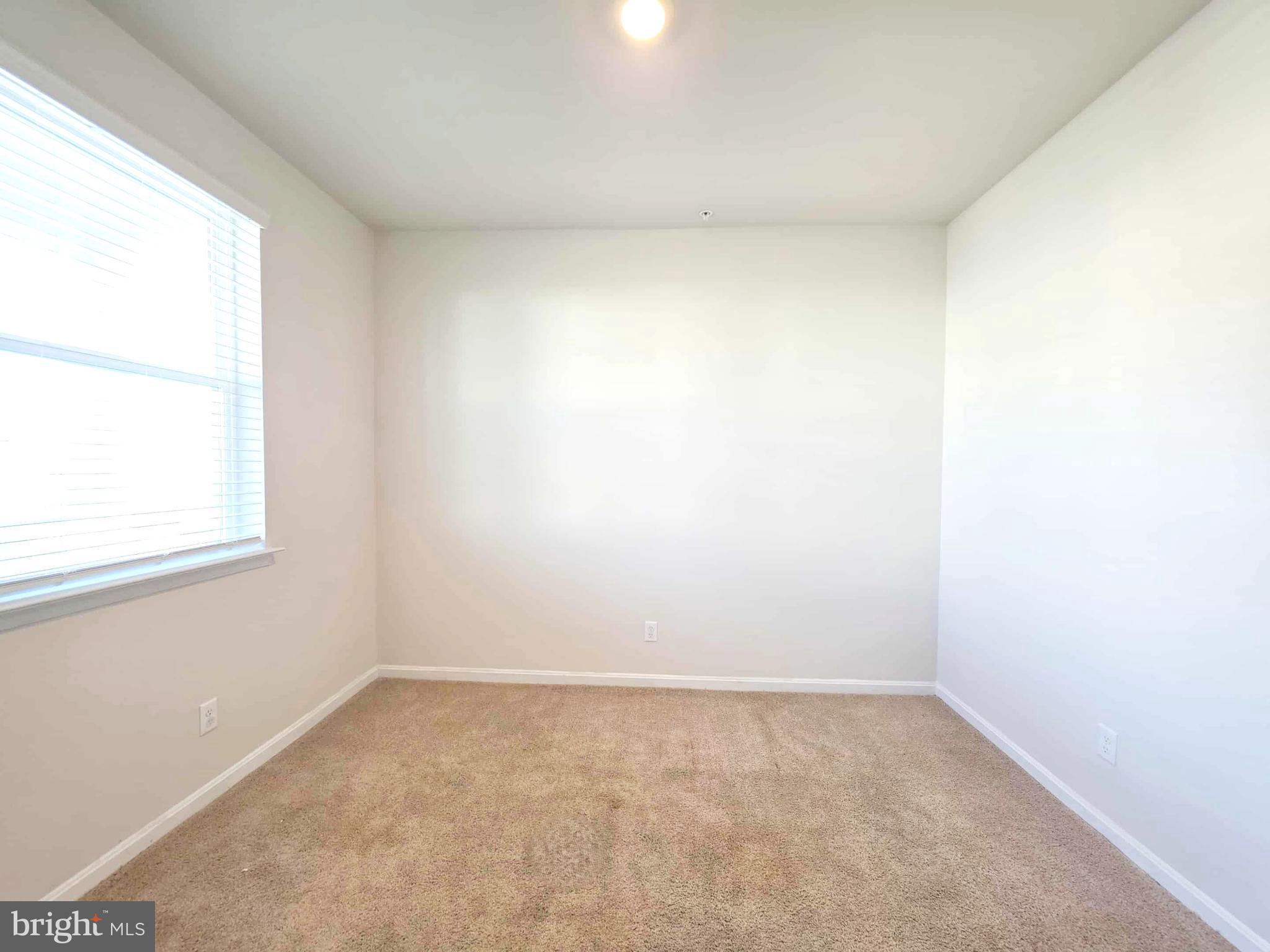 374 Robbins Farm Road Cambridge, MD 21613 - Photo 13 of 48 an empty room with a window