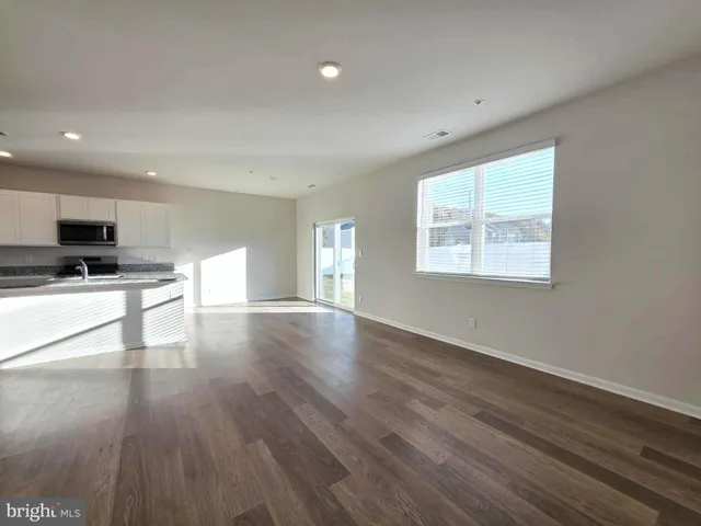 a bathroom with a sink a mirror and a window
