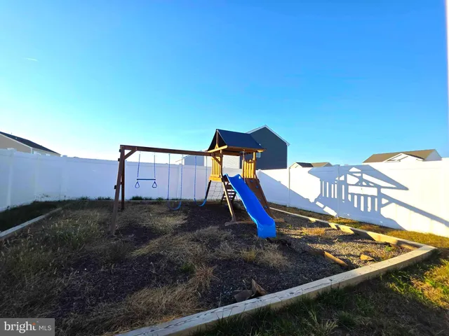 a view of a backyard with sitting area