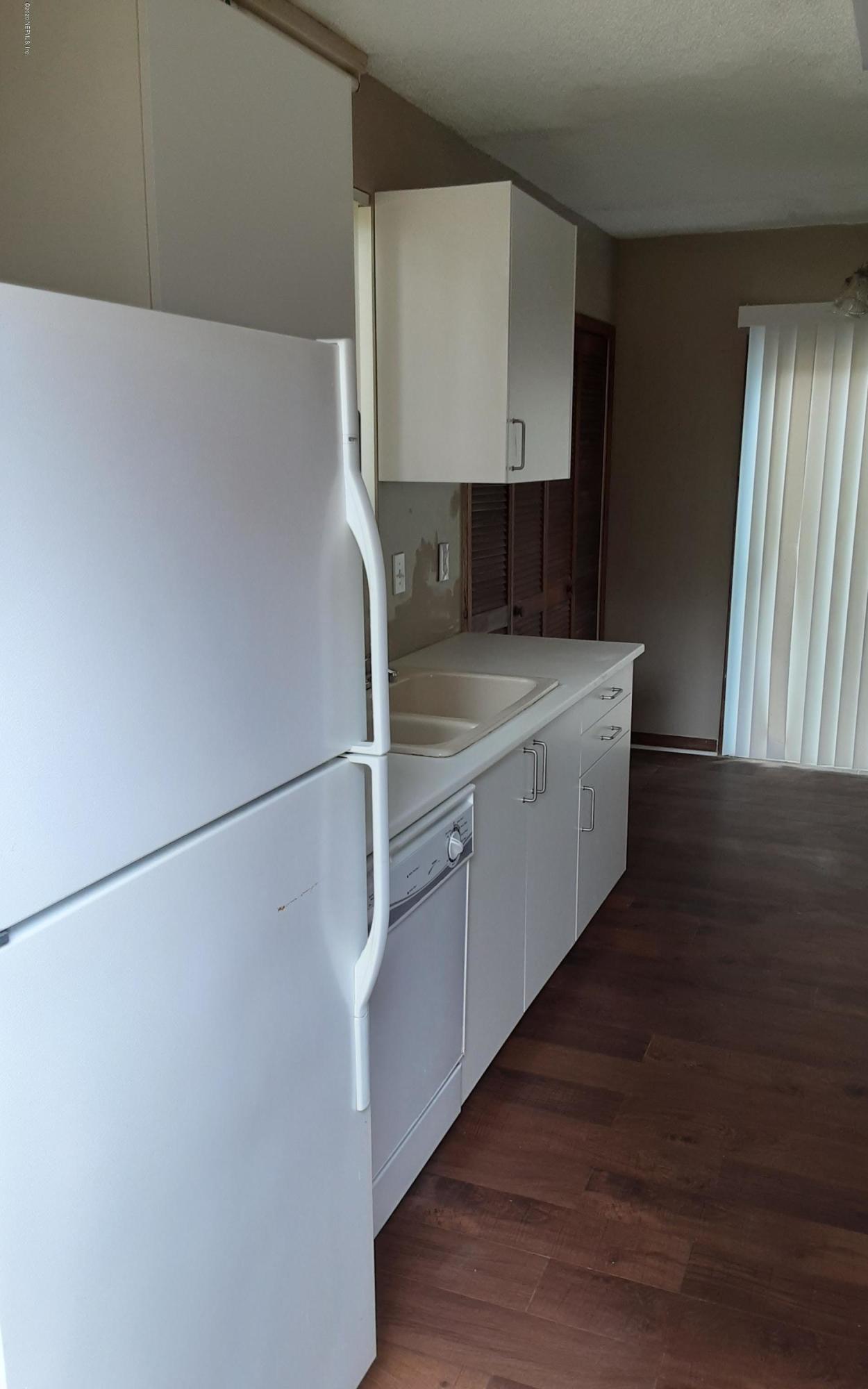 2100 Cornell Road Middleburg, FL 32068 - Photo 11 of 20 a kitchen with stainless steel appliances a refrigerator and a sink