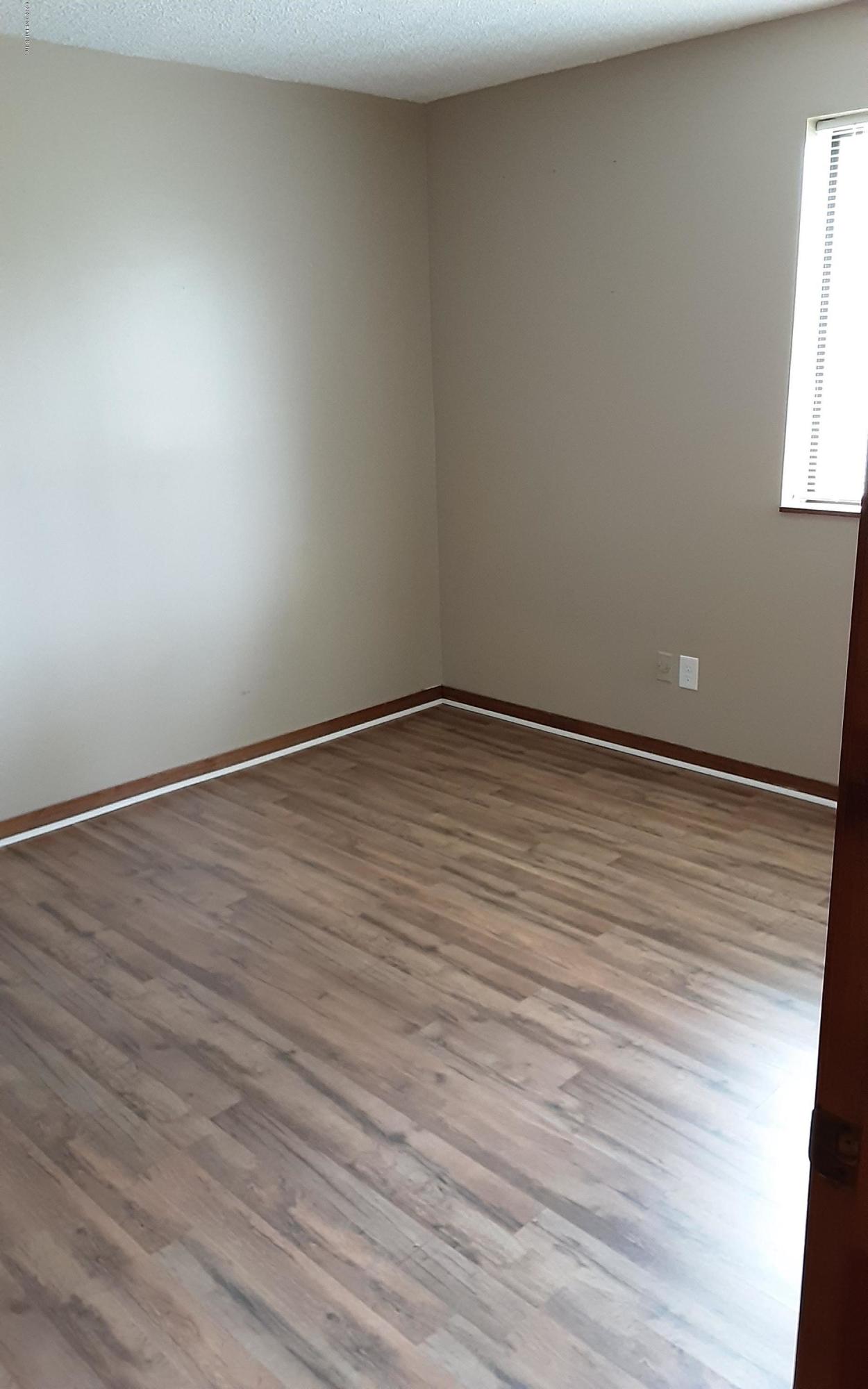 2100 Cornell Road Middleburg, FL 32068 - Photo 13 of 20 an empty room with wooden floor and windows