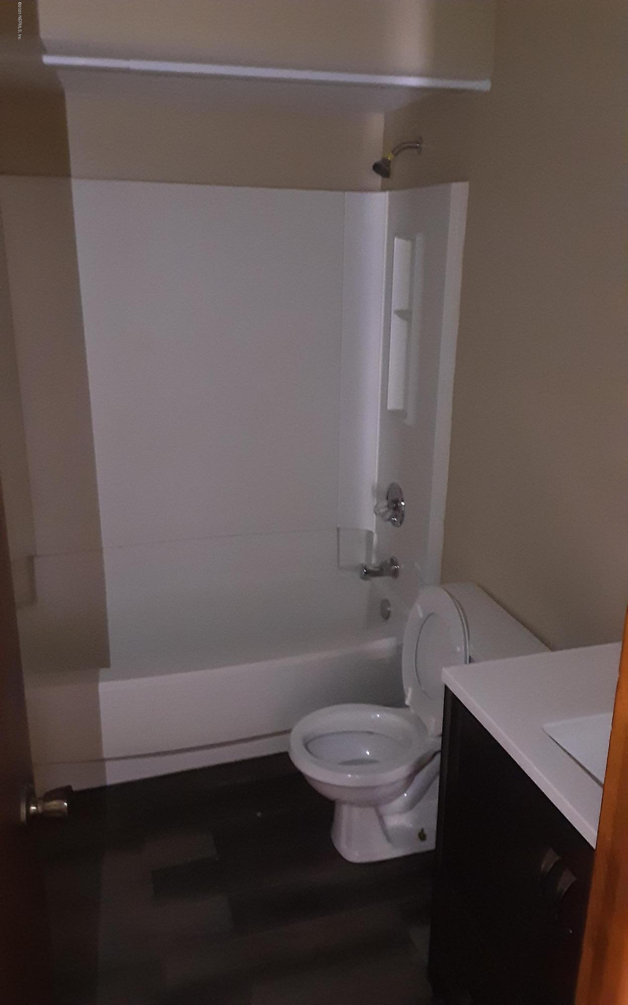 2100 Cornell Road Middleburg, FL 32068 - Photo 15 of 20 a bathroom with a toilet and a shower