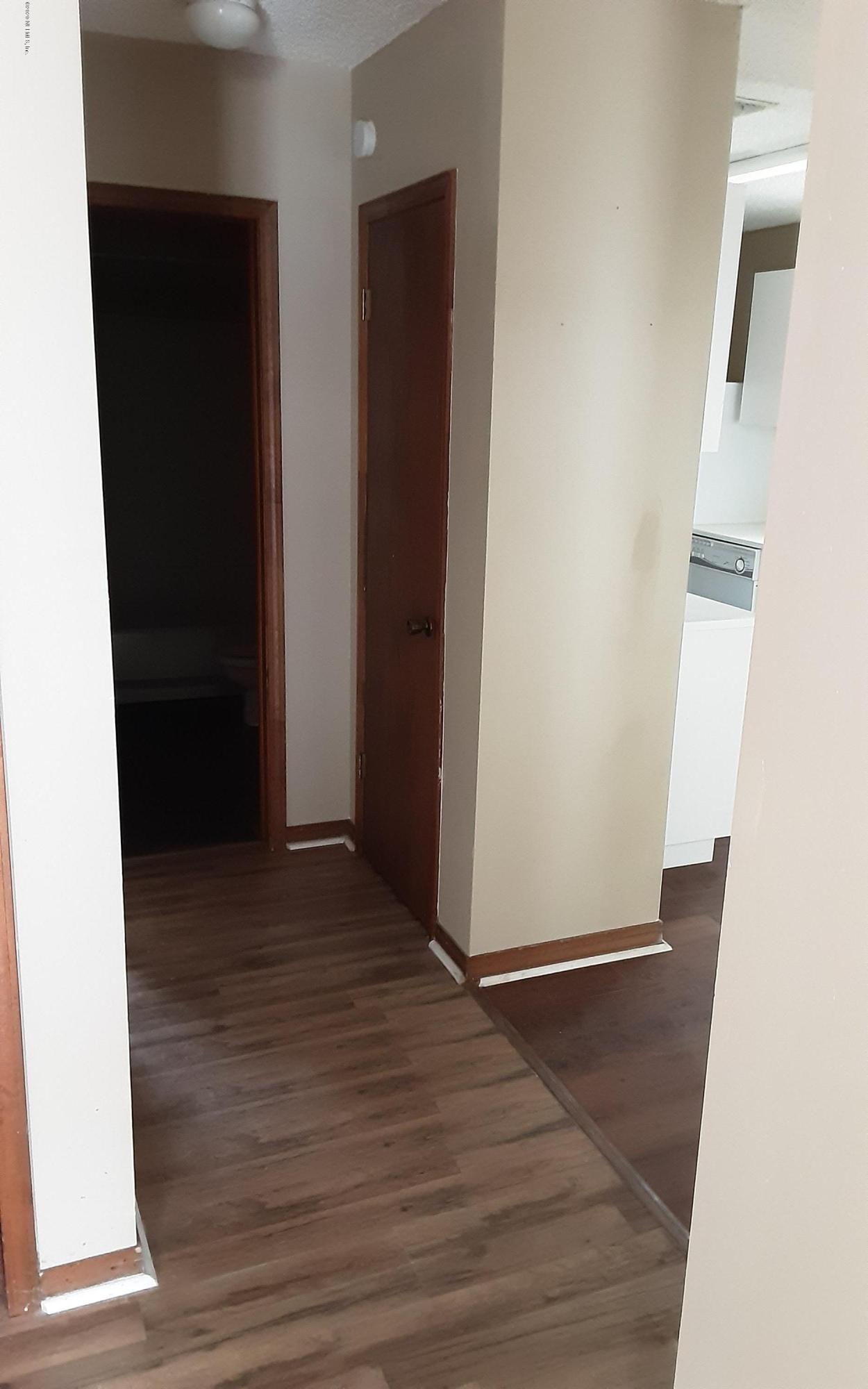 2100 Cornell Road Middleburg, FL 32068 - Photo 18 of 20 an empty room with wooden floor and closet