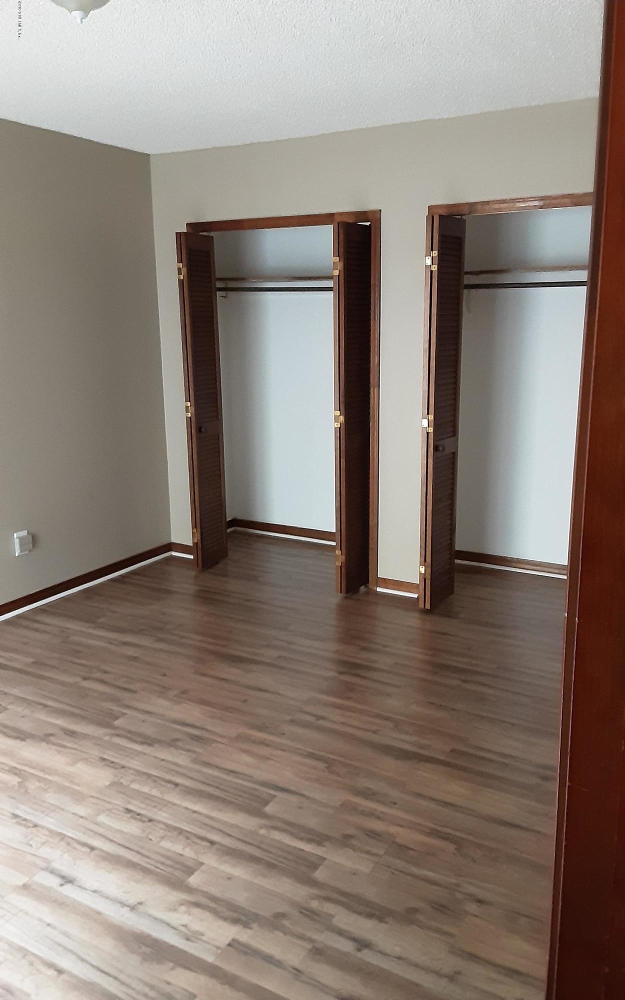 2100 Cornell Road Middleburg, FL 32068 - Photo 5 of 20 an empty room with wooden floor and closet