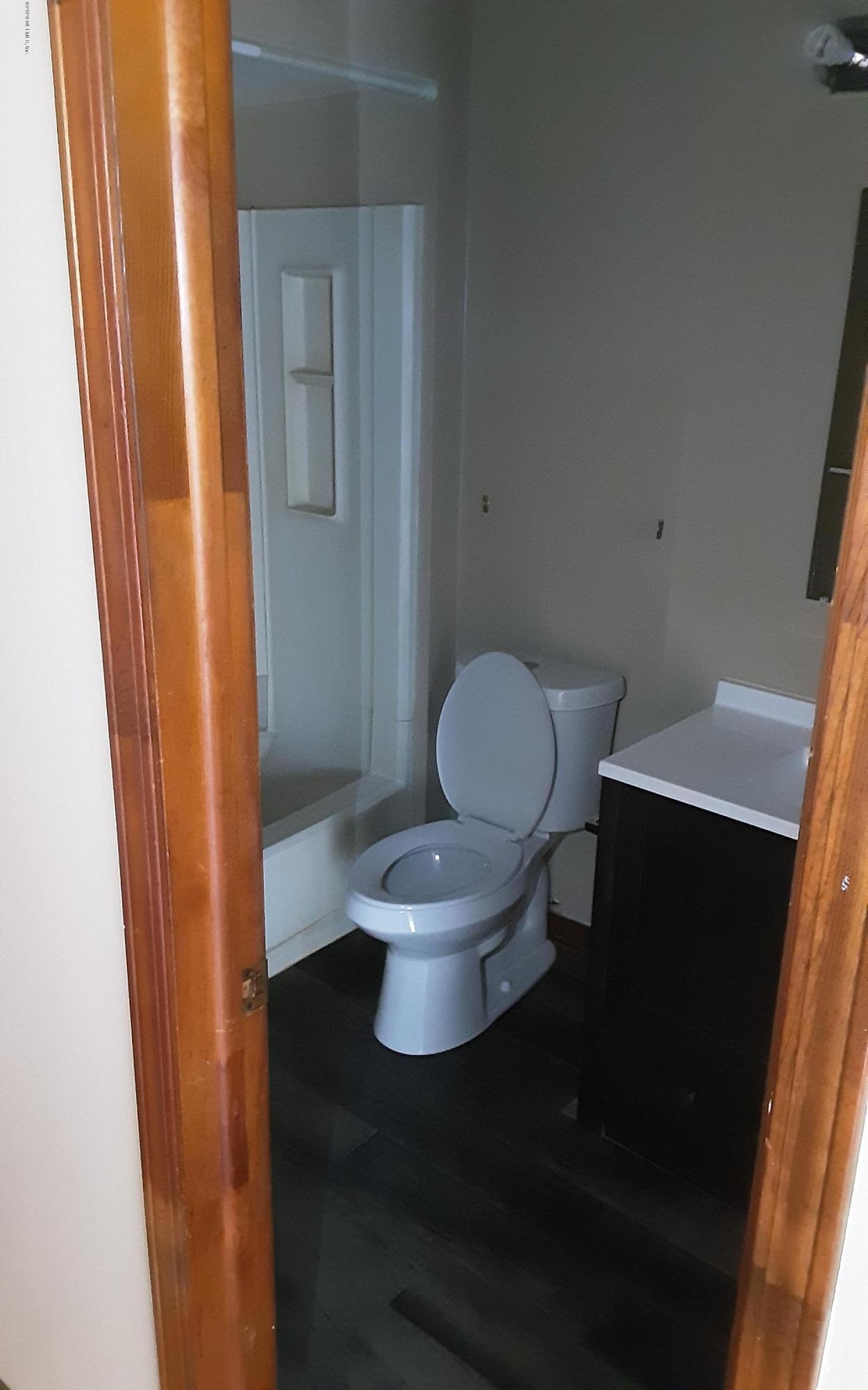 2100 Cornell Road Middleburg, FL 32068 - Photo 8 of 20 a bathroom with a toilet and a mirror