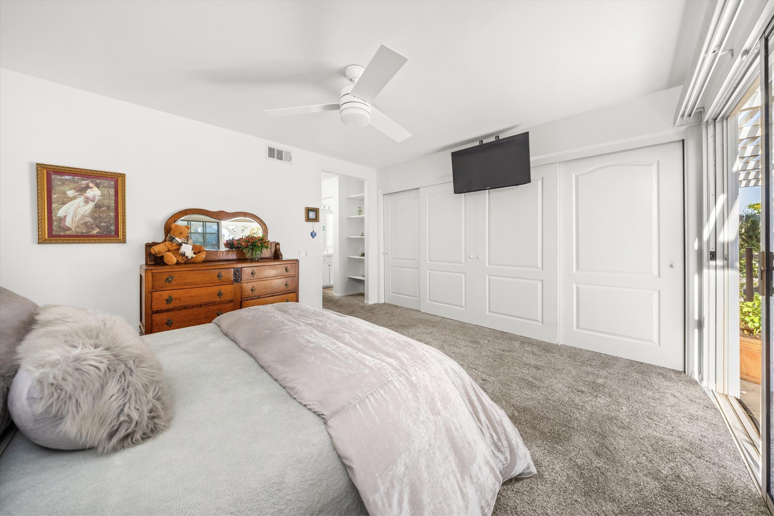 4565 Chapparral Drive Carpinteria, CA 93013 - Photo 12 of 23 a bedroom with a bed and a flat screen tv