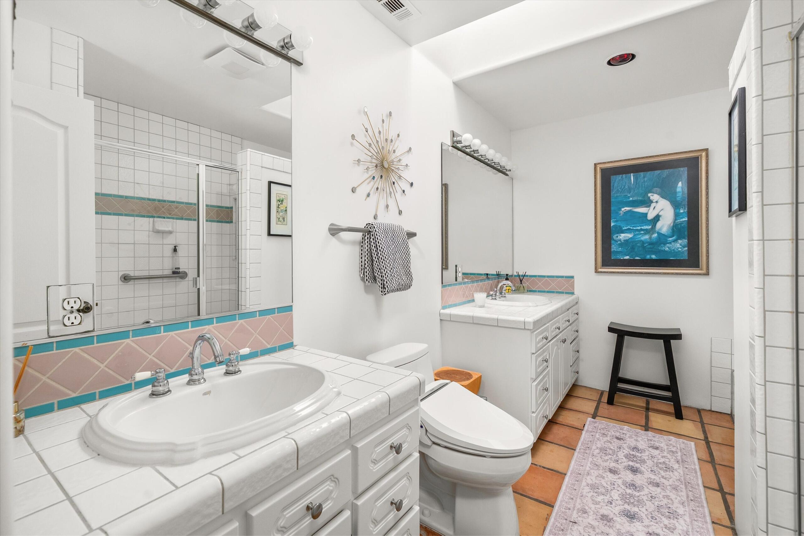 4565 Chapparral Drive Carpinteria, CA 93013 - Photo 13 of 23 a bathroom with a sink toilet and shower
