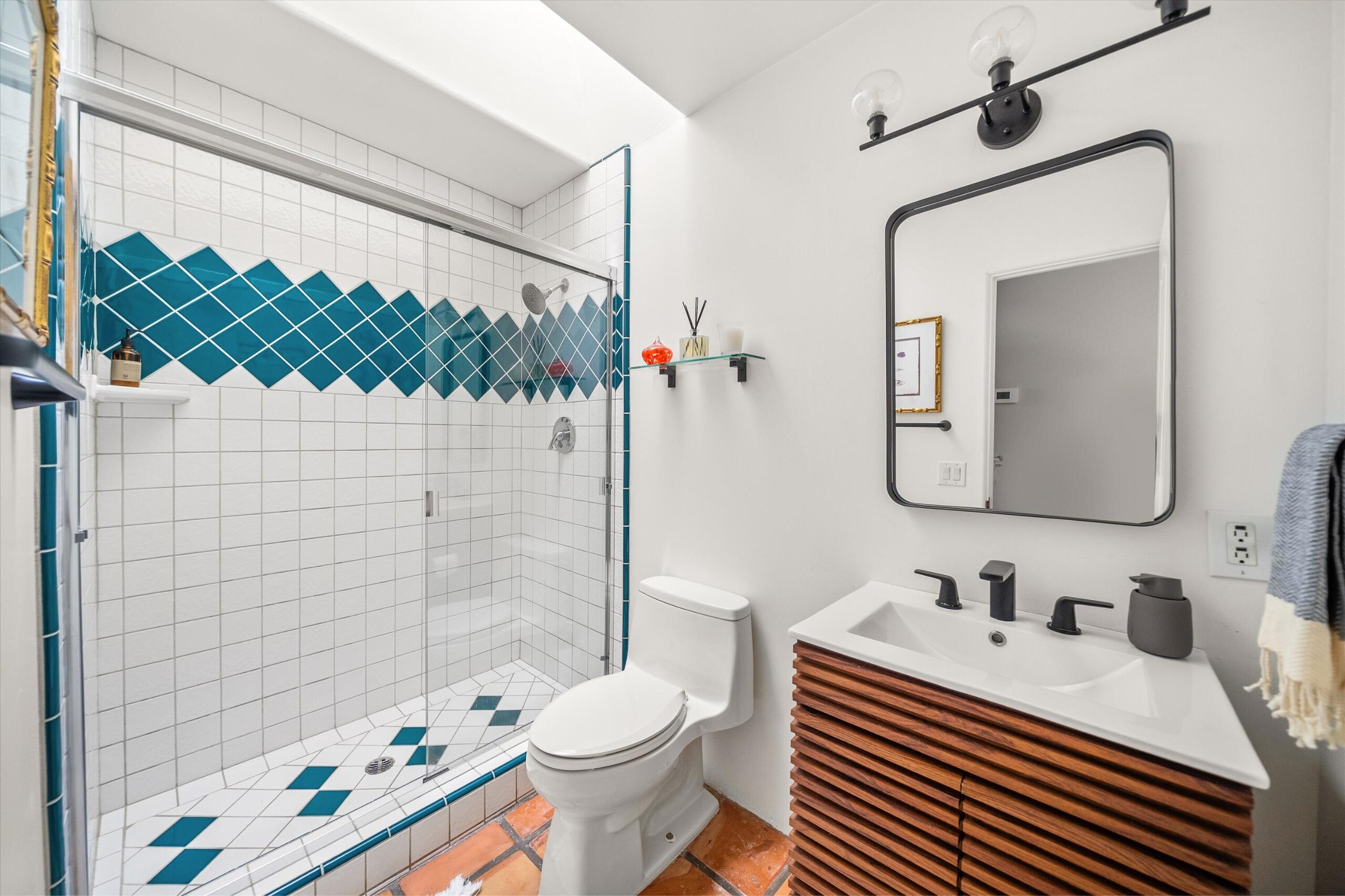 4565 Chapparral Drive Carpinteria, CA 93013 - Photo 15 of 23 a bathroom with a sink a toilet and shower